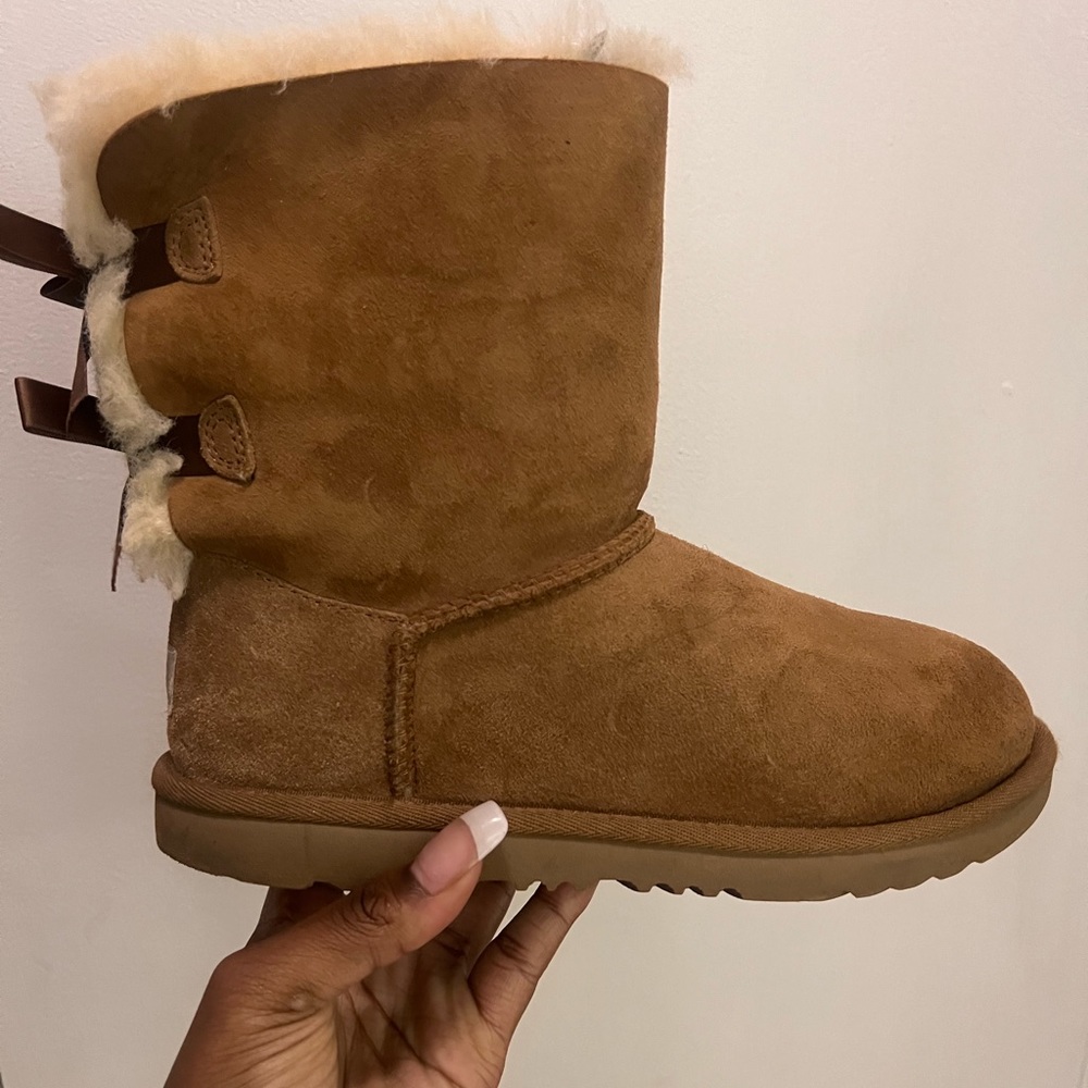Size 5 Ugg boots with brown bows, barely worn